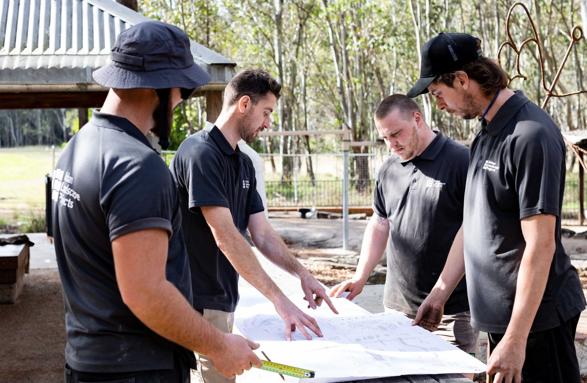 ULP team reviewing plans on site during construction